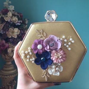 gold floral clutch